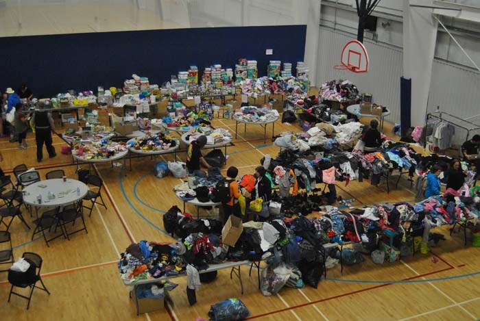  Tables of clothing, luggage, food and drinks, toiletries and many other items were ready for the evacuees of the 2016 Fort McMurray fire as the Bold Center was transformed into an emergency shelter and headquarters.
