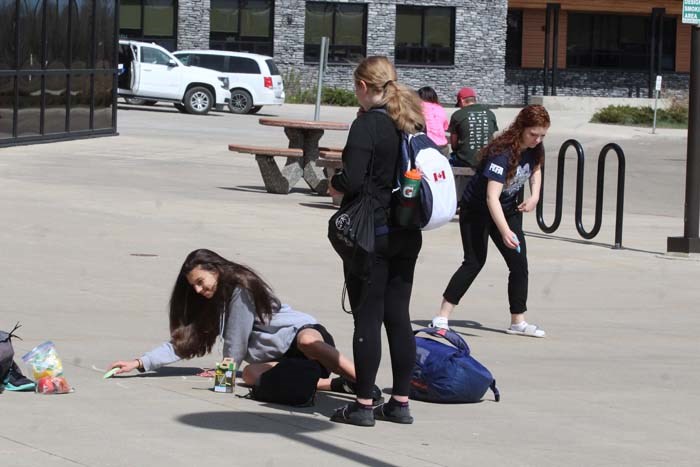  Some visiting athletes also heard about the county's chalk the walk event, grabbed some chalk from the Bold Center and contributed towards the sidewalk's handiwork