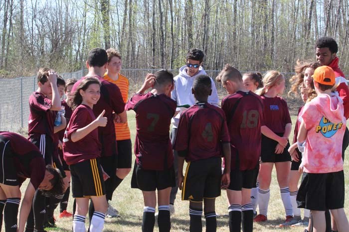  Zone 9 coach's team talk during half time. The team went ahead and won first place beating zone 5's team   4-0