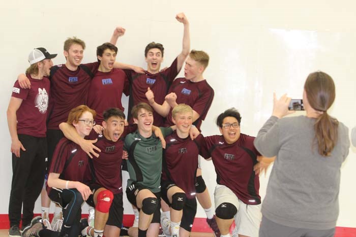  Zone 9's Men's Volleyball team celebrates after they beat Zone 5's team during Sunday's final