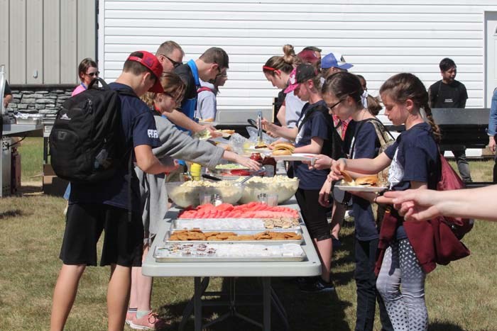  Students gathered at the JAWS lawn behind the school for a BBQ supper after the competitions