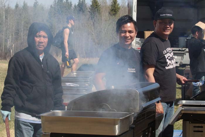  Raja Israel, RJ Foronda and Ben Arao from Master Caterers (Bonnyville) were busy working the grills. They made more then 700 burgers in the afternoon catering for Sunday's BBQ