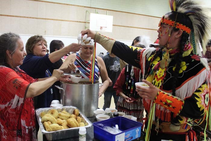  Stew and Bannock was being served for lunch by Amisk School's Cree teacher. Utin Cardinal, a grade 10 student from Saddle Lake grabs a spoon for his stew