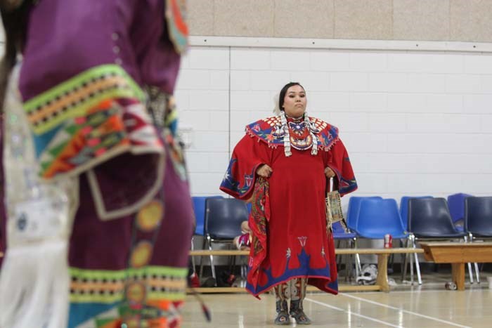  Utin Cardinal and Raven Wood showcase their colourful attire as they perform in the school's gym