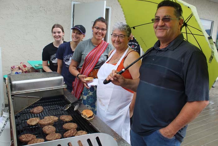  Crew from the Lac La Biche Mission was a busy bunch at lunch. They were busy serving a long queue of people with their delicious burgers