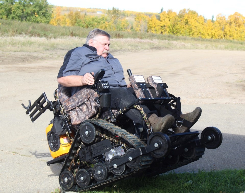  There were some speciality items also on display at Hunt Mania. Show organizer Randy Schlender took out the Action Track chair for some action demo