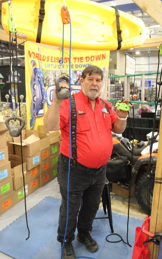  Sales person Gary Keetch demonstrating his product the Tie Boss at the trade show