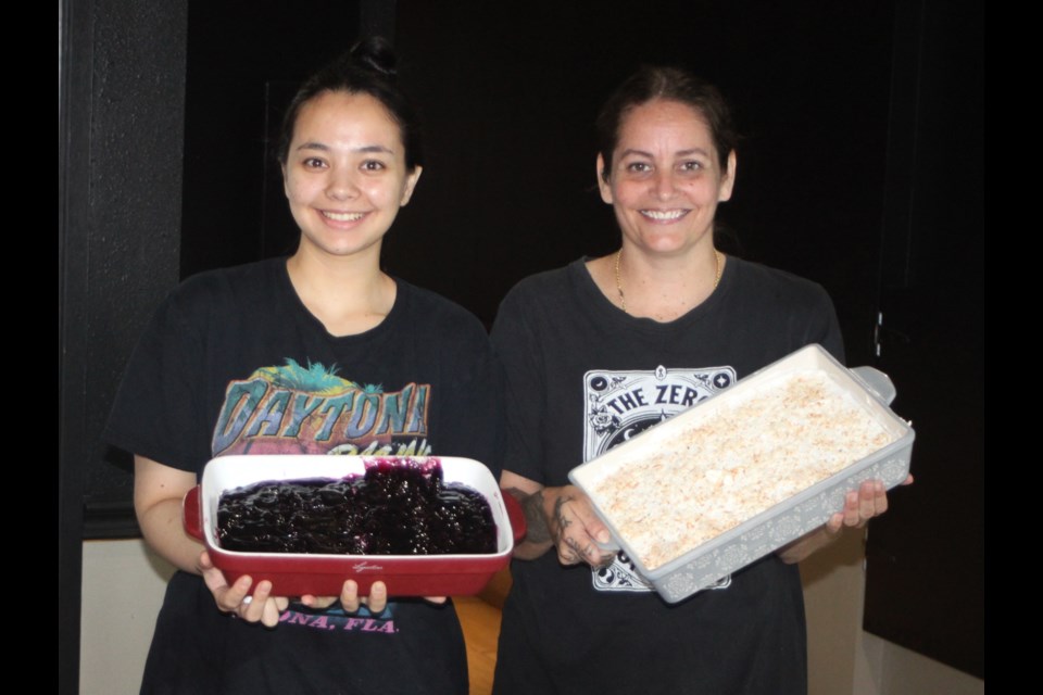 Jenna Kilby, right, owner of Oslo's Eatery, and her sister, Ranyuta Kilby, hold some of the desserts that are available at the Lac La Biche restaurant. Oslo's won first place in six categories in the 2025 Lakeland's Best competition, including best dessert. Chris McGarry photo. 