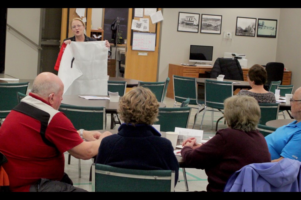 Jennifer Gauthier, a health promotion facilitator with Alberta Health Services, spoke about emergency preparedness to the group of seniors from the Lac La Biche area who attended the workshop at the Lac La Biche Heritage Society on March 24. Chris McGarry photo. 