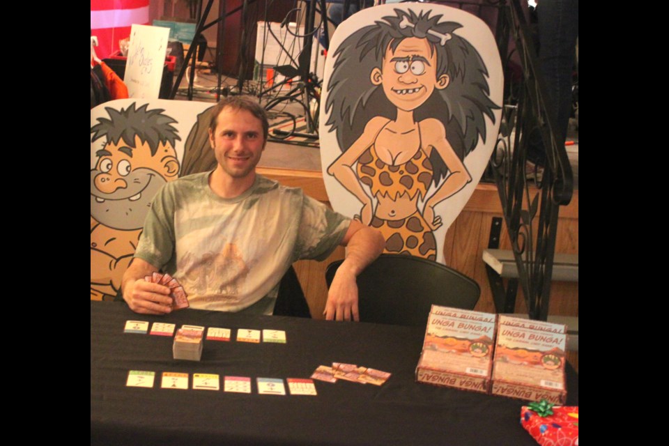 Jesse Hlushko, a game developer who lives in the St. Paul area, promoting his most recent game, UNGA BUNGA, at the Lac La Biche Christmas Farmer’s Market. Chris McGarry photo. 