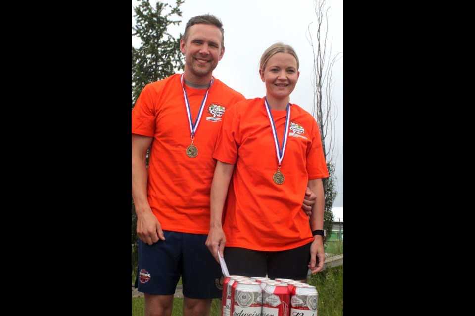 The Jacksons standing on the podium after the 2024 wife carrying race had concluded. Chris McGarry photo. 