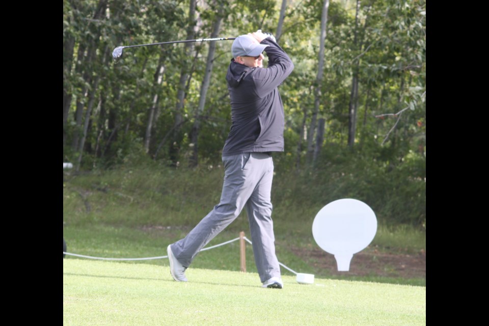 Joel Marak tees off during the start of the 2025 Voyageurs Golf Classic. The third edition of the event, which helps to raise money for student athletes at Portage College, took place on Aug. 21 at the Lac La Biche Golf and Country Club, and featured 96 golfers playing in 24 teams. Chris McGarry photo. 