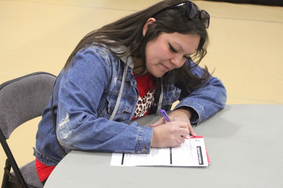 Keesha White fills out an application at the Portage College spring open house event, which took place at the college’s Lac La Biche campus on March 24. / Chris McGarry photo.