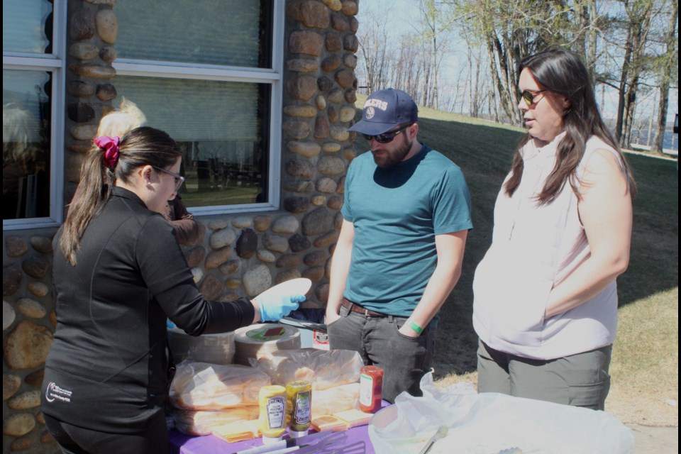 Kristen Shewchuk, a community outreach worker with Lac La Biche County FCSS, chats with David Shewchuk and Danielle Kohn at the volunteer appreciation BBQ, which took place on May 3 at McArthur Park in Lac La Biche. Chris McGarry photo. 