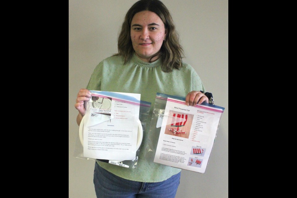 Laney Smith, programming coordinator for Lac La Biche County Libraries, holds up two examples of the Steampunkery kits currently being offered by the library. Chris McGarry photo. 