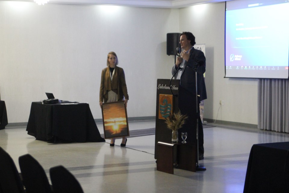  LICA board chair Amanda Avery Bibo presented a gift from LICA to Jickling after his presentation.