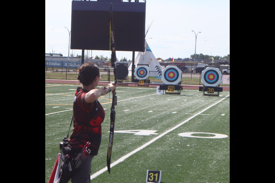 Lisa Darlington, a member of the Ontario archery team that competed in the 2025 3D, Field, and Target Outdoor Canadian Championships in Lac La Biche from Aug. 2-9, focuses downrange as she prepares to shoot in the barebow competition for the target finals on Aug. 9. Darlington won gold in the event. Chris McGarry photo. 