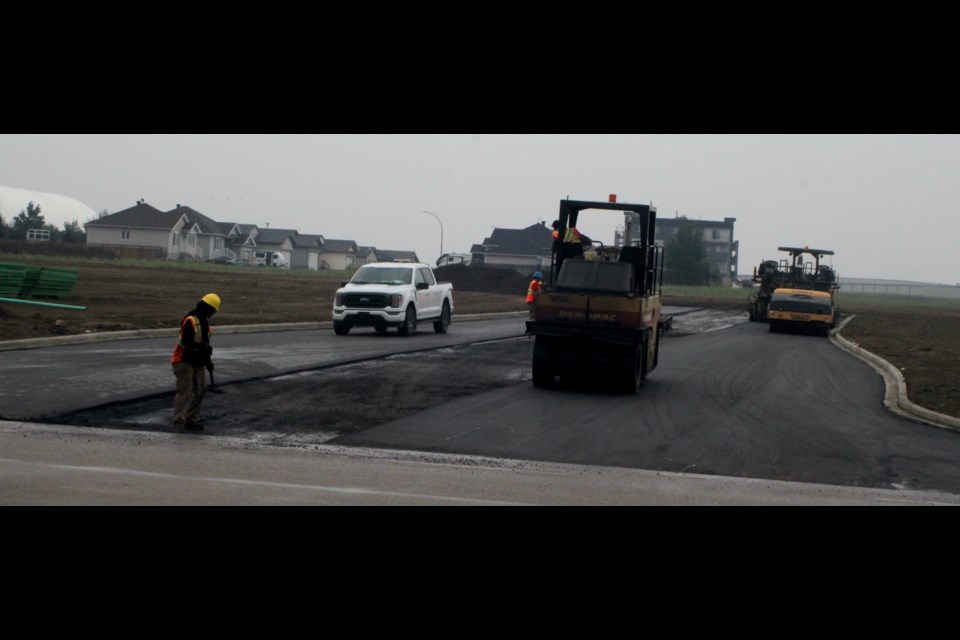 Construction crews work on an access to a 12-acre parcel of municipal land close to the Bold Centre. Chris McGarry photo. 