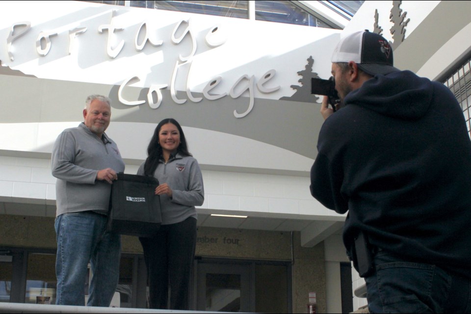 Portage College Community Social Work student Lyric Lewis with Portage Athletic Director Jim Knight. Lewis earned a sport at the Canadian national collegiate golf championships in Quebec.