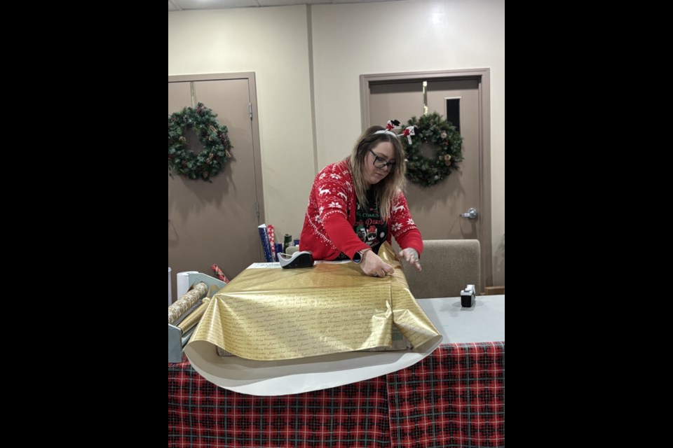 Volunteers from the Cold Lake Community Church generously offered free gift-wrapping services to visitors at the first Greatest Gift Christmas Market.