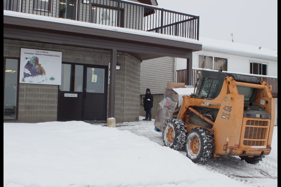 Khalil Abougouche delivers a palette of groceries via forklift to the friendship centre. Chris McGarry photo. 