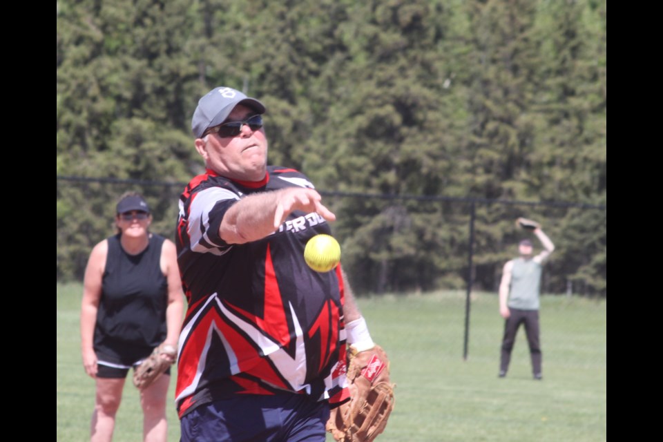 Neil Timm pitches during a game at the Bold Centre ball diamonds on May 24 for the slo-pitch tournament that raised $10,110 for the Lac La Biche Big Brothers Big Sisters program. Chris McGarry photo. 