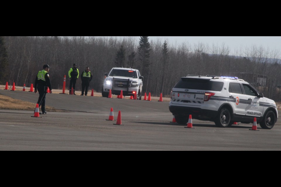 Peace officer cadets and instructor being emergency vehicle driving training at the air tanker base in Lac La Biche during the first week of April. According to Chris Clark, director of the Law Enforcement Training program, The new track will be almost double the size of the current training area, and will also be operational throughout the year. Chris McGarry photo. 