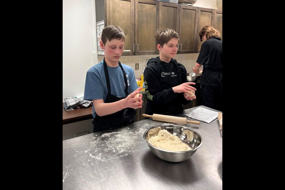 Teen participants in the Teen Skillzone program participate in the pita party that took place on March 28 at McArthur Place in Lac La Biche. The session, which was put on through the Lac La Biche County FCSS Teen Skillzone program, taught kids how to make pita bread and also included a presentation on healthy eating. Photo supplied. 