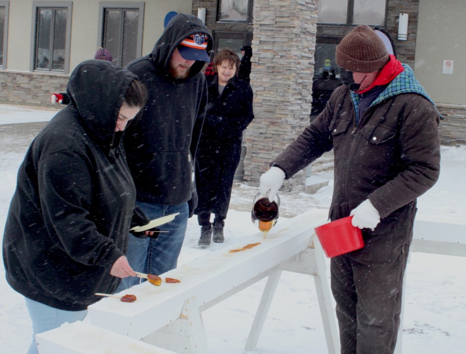 pouring-maple-syrup-on-snow-222