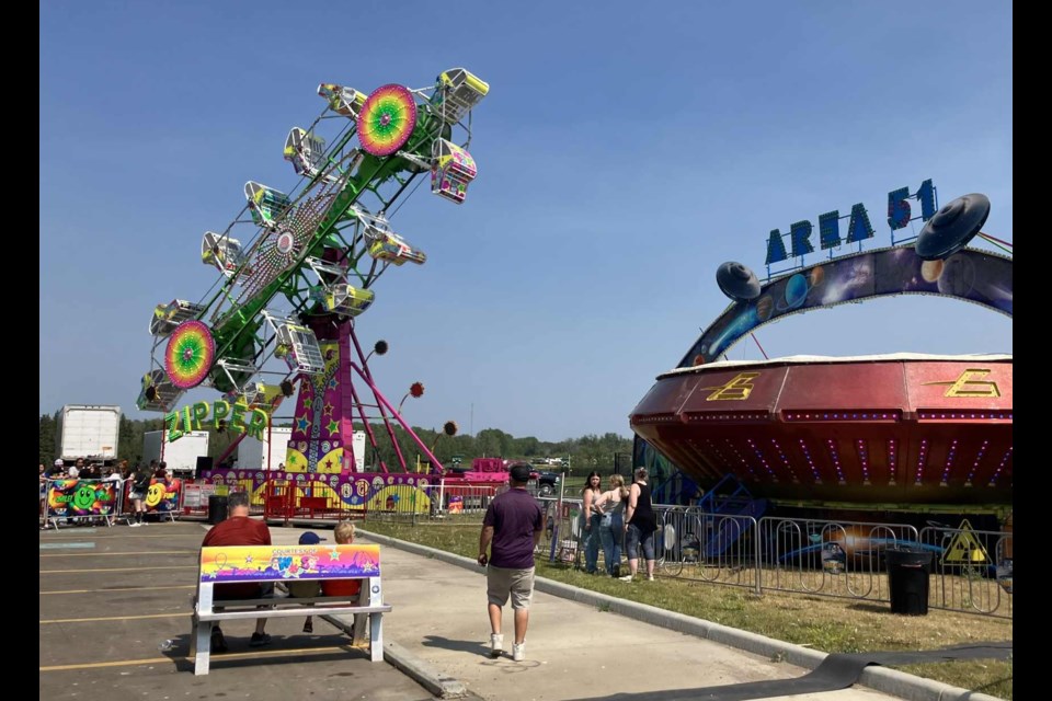 There was a variety of thrilling rides on offer at the Pow Wow Days midway, including one called the Zipper, and another, Area 51, which resembled a very fast UFO. Chris McGarry photo.