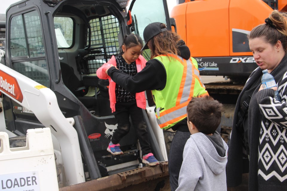 Students were allowed to sit in some of the equipment the city uses. 