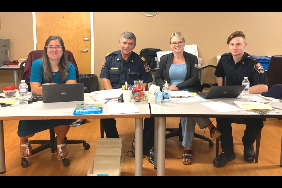 Reception center staff include (left to right) Karen Shewchuk, Emergency Support Services (ESS) reception center coordinator, John H. Kokotilo, Manager of Protective Services/Incident Commander, Amanda Cheyne, reception center coordinator, and Firefighter Elijah Sokorinski. / Submitted photo. 