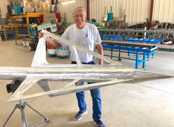 Many towns are renowned for having unique and quirky landmarks. Soon, Lac La Biche will be able to lay claim to not only the biggest - but longest arrow in the world. Rene Schaub, president of the Lakeland Archers, stands next to the broadhead of the arrow, which is currently being worked on by Savailin Enterprises Ltd. in Lac La Biche. Chris McGarry photo. 