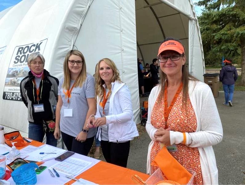 Lyndi Mills (right), who lives outside of Athabasca, survived breast nearly cancer 13 years ago. She is also a director on the board of the Road to Hope Community Support Foundation. Mills, far right, at a Road to Hope event in 2021. Also in photo are Dawn Yurkowich (volunteer), Jessica Wallace (coordinator) and Melinda Katona (volunteer). Submitted photo. 