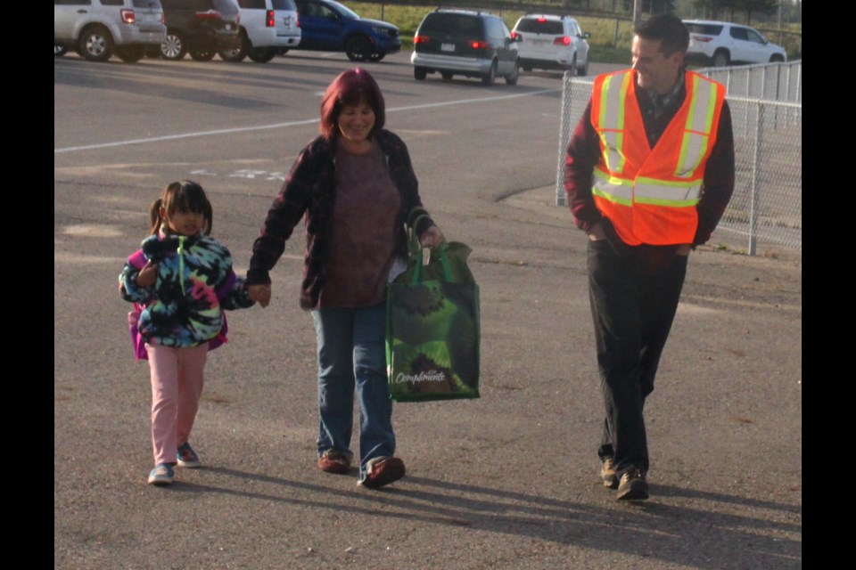 Rob Wicker will be retiring at the end of June after 29 years of teaching. He is currently principal of Vera M. Welsh Elementary School in Lac La Biche. Wicker chats with Mel Little, who was taking her granddaughter Everly Sinclair to her first day of school on Sept. 5, 2023. Chris McGarry photo.