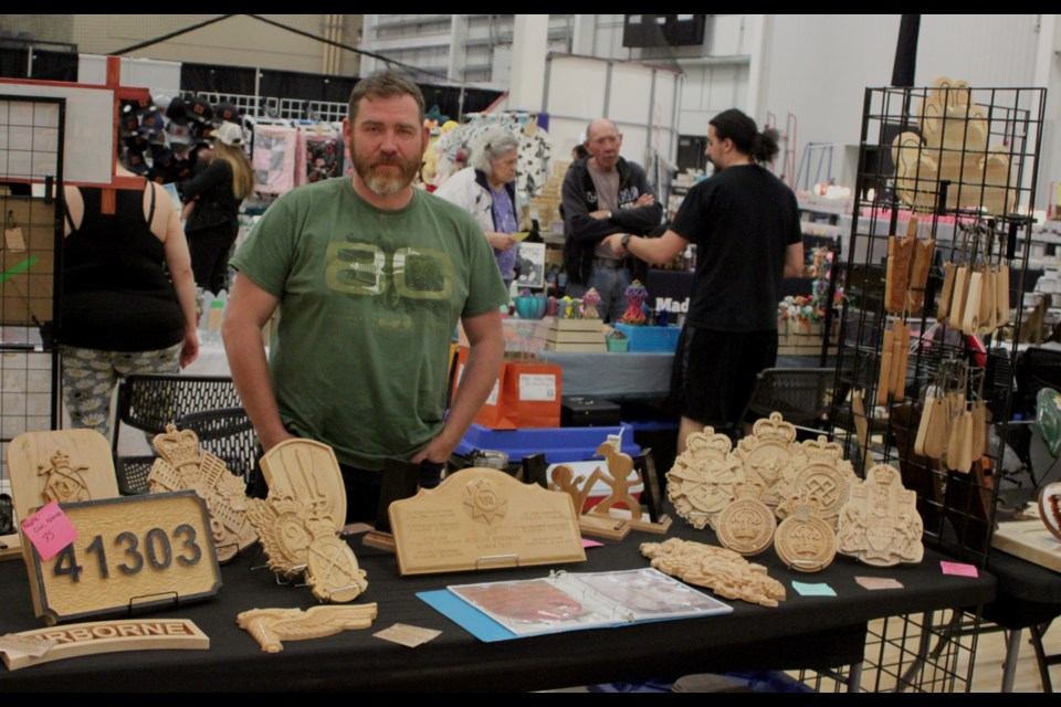 Roscoe Wiseman, owner of Creative Customs, based in the Cherry Grove area near Cold Lake, was at the 2025 Spring Trade Show and Market selling handcrafted military crafts, custom-made signs and other products. The event, which was put together by the Lac La Biche and District Chamber of Commerce, took place on May 3 and 4 at the Bold Centre. Chris McGarry photo. 