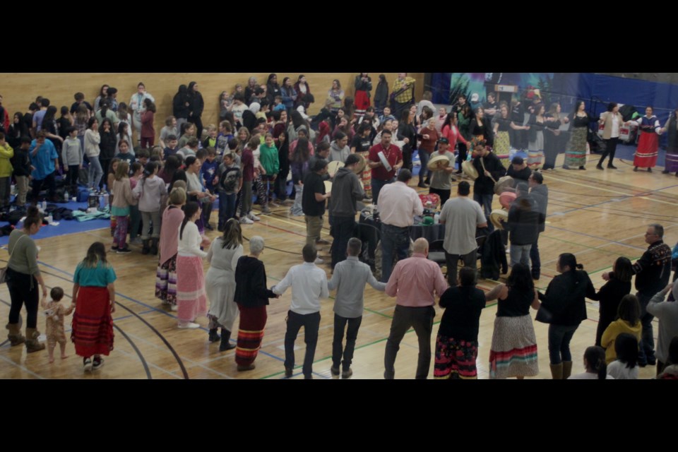 Layers of Round Dance participants circle the drummers during Thursday's annual Portage College Round Dance.