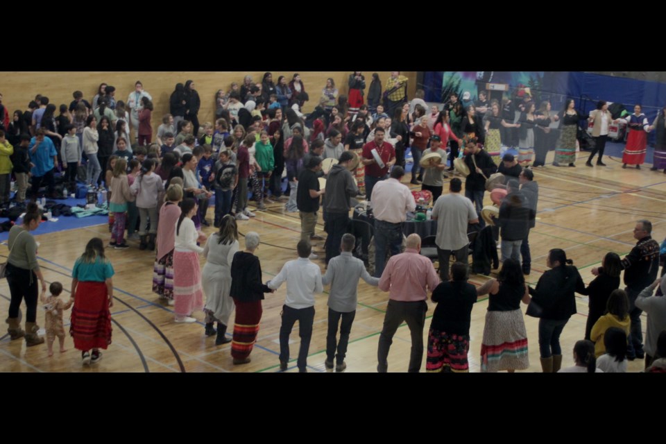 Layers of Round Dance participants circle the drummers during Thursday's annual Portage College Round Dance.