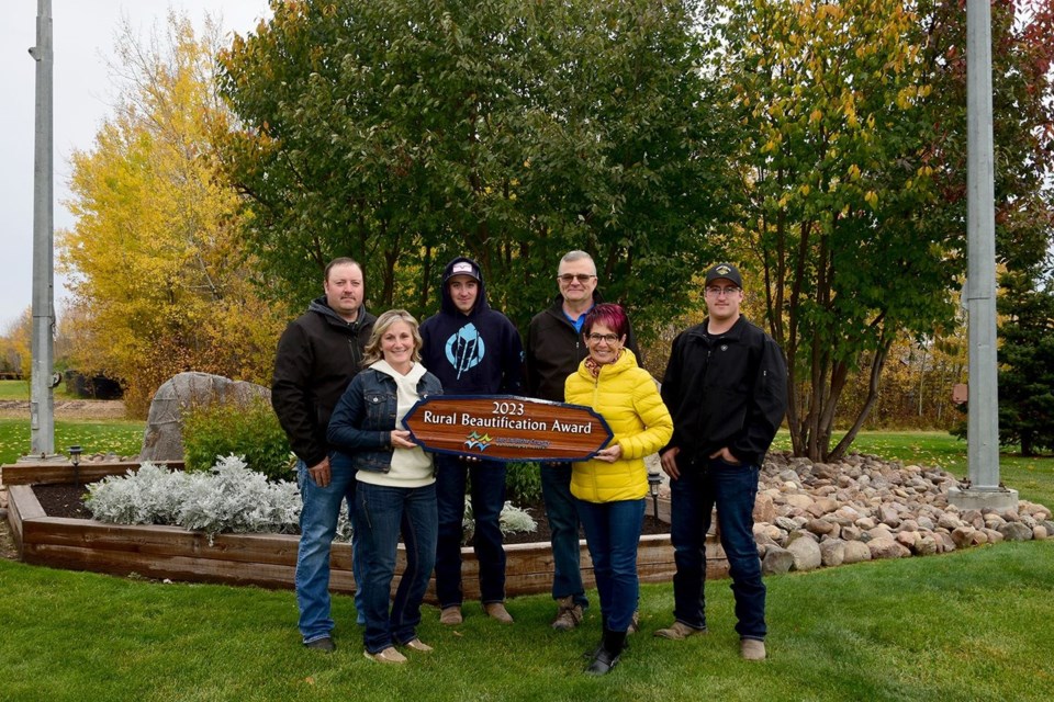 Julian and Charmayne Lemay, who live on an acreage south of Plamondon, are the winners of the 2023 Rural Beautification Award. In photo, from left to right; Julian Lemay, Charmayne Lemay, Riley Lemay, Coun. Kevin Pare, Coun. Colette Borgen, and Cole Lemay.
