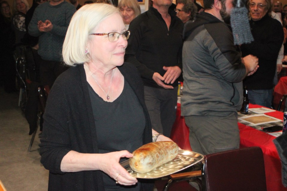 Ruth Fyten served as the haggis bearer for the Robbie Burns event. Chris McGarry photo. 