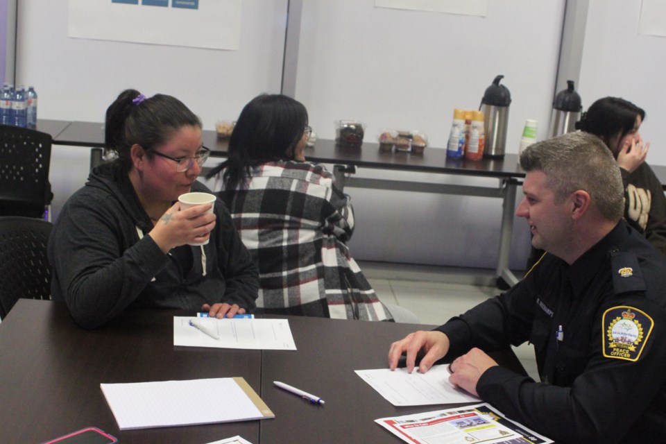 Ryan Deschamps, manager of Enforcement Services for Lac La Biche County, has a talk with Melissa Jackson, who attended the open house held at the Lac La Biche County Protective Services building on Nov. 29. Chris McGarry photo. 