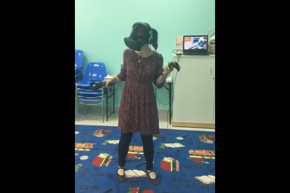 Meredith Kerr checked out the Virtual Reality headset when it visited the library in 2018.