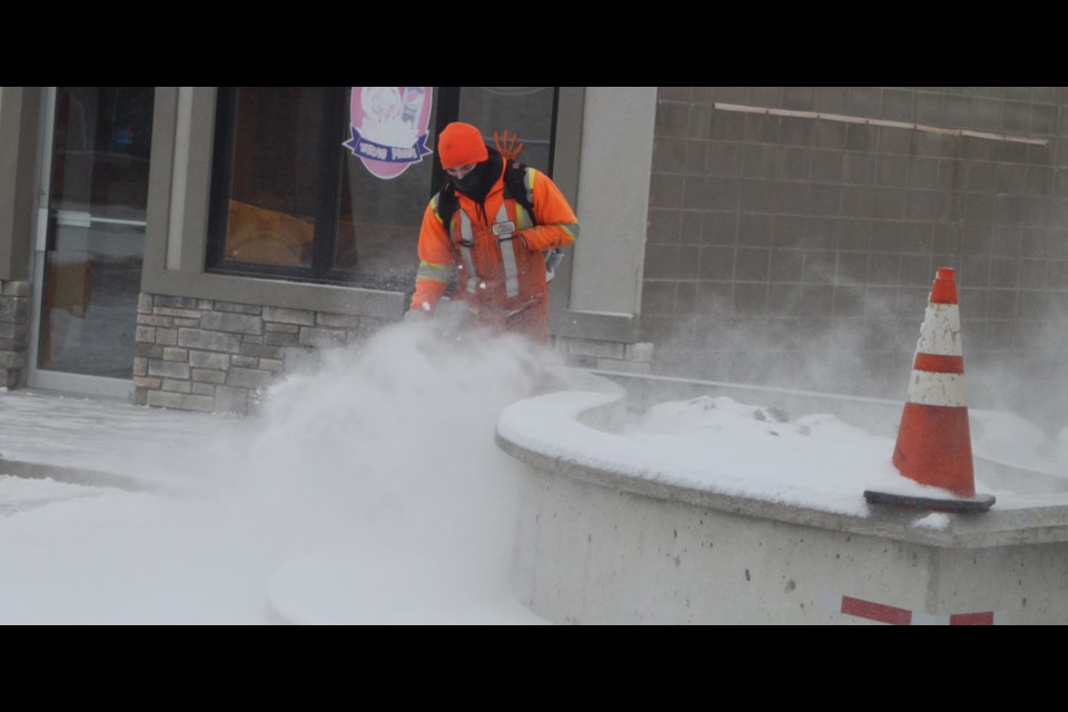Municipal crews were busy Thursday morning on Lac La Biche's Main Street clearing a late March dusting of snow.
