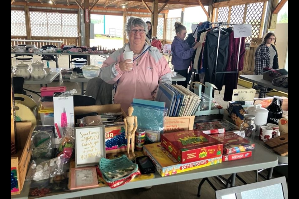 Sonia Rovang sold a variety of stuff from her home, including books, toys, games, and picture frames, at the Lac La Biche Agricultural Society's annual community garage sale, which took place on June 7 at the Lakeland Agricom. Chris McGarry photo. 