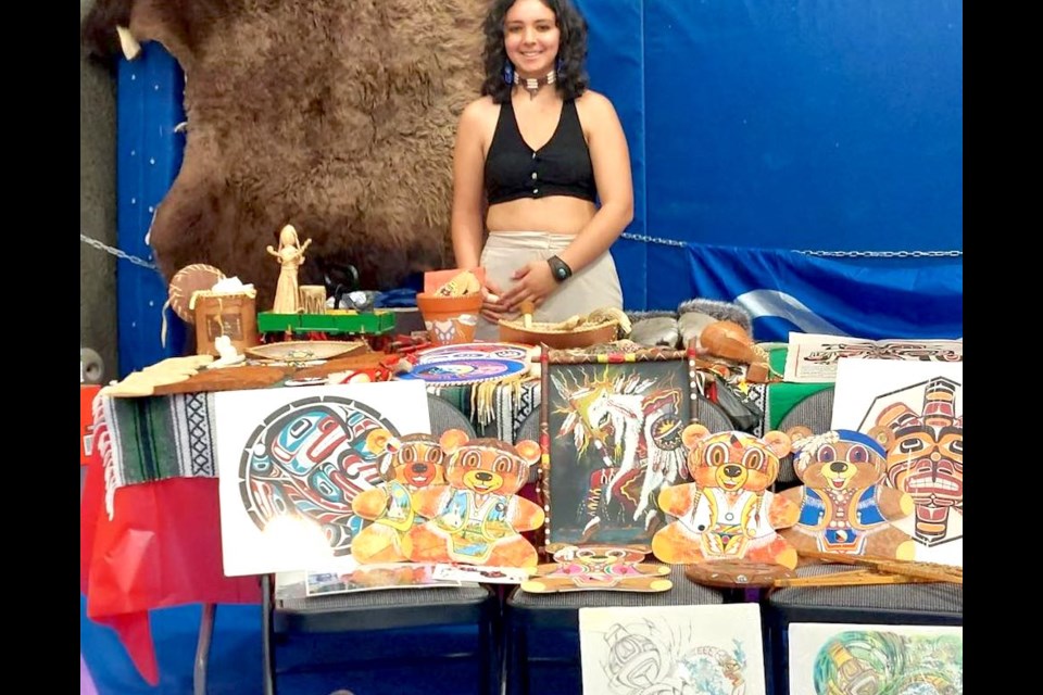 Soul Dachuk stands with some of her artwork. Dachuk, who is from Grimshaw, is a student in the Native Arts and Culture program at Portage College. Submitted photo. 