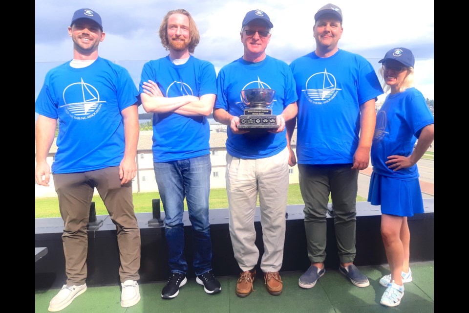 Stephen Marsden, a Cold Lake resident and recreational sailing enthusiast, and the crew of his boat, the Ragnar Danneskjöld, recently won the 25th annual Prairie Endurance Challenge, which took place in Cold Lake from Aug. 12-13. Pictured (left to right) are Derek Campbell, Paul Veltri, Stephen Marsden (holding the Hornet Class Trophy), Ethan Walker, and Dorothy Peckham. Submitted photo. 