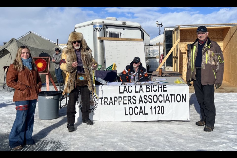 Members of the Lac La Biche Trappers Local 1120 at the 41st Winter Festival of Speed. In photo are; Aliyah Skyrpan, Phil Jones (in background), Dale Richard , Victor Amiot (sitting) and, Dale Crossland. Submitted photo. 