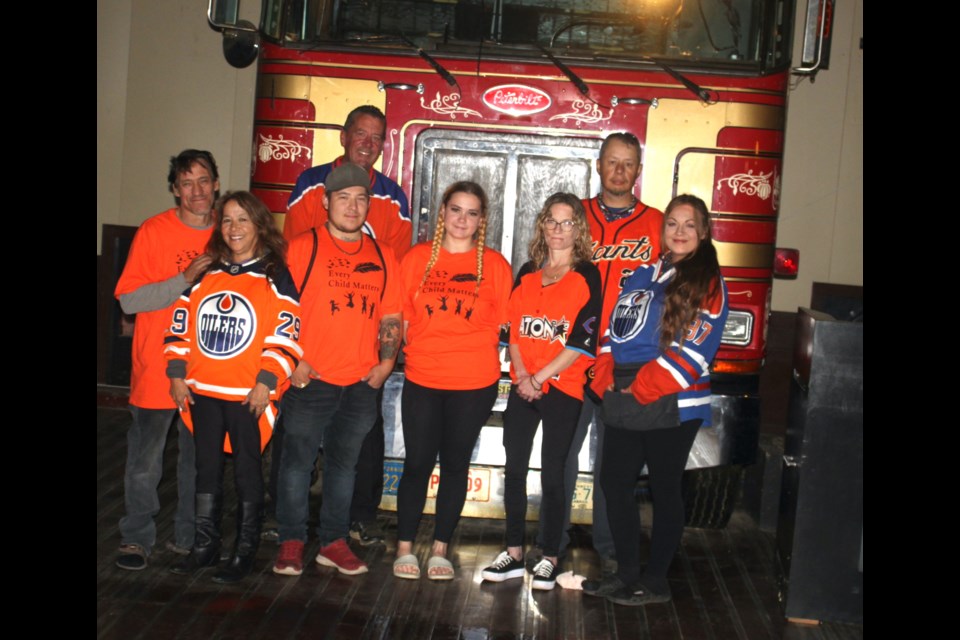 Staff of Truckers are pictured. The bar celebrated its reopening Sept. 29 and 30. Back row, left to right; Brent Hughes (manager/head chef) Bart Lavallee (bartender). Front row, left to right, Kevin Halter (owner), Brenda Halter, Alvin Halter, Jayme Waselenchuk (bartender), Aimee Gauthier (bartender/server) and Ocean Jane (bartender/server) Chris McGarry photo. 