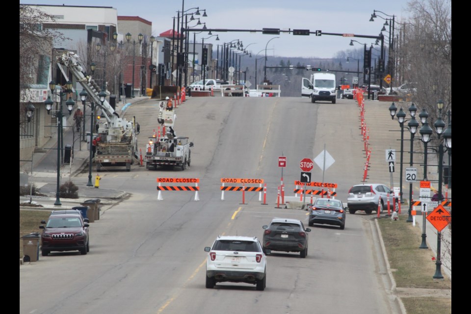 Traffic driving north along 101 Avenue (Main Street) in Lac La Biche uses the detour that was constructed next to McArthur Park last September for the third and final phase of the $32.5 million Main Street Revitalization project. The section of Main Street from 101 Street to 100 Street was closed off on April 22 for the 2025 construction, which is expected to last into early fall. Chris McGarry photo. 
