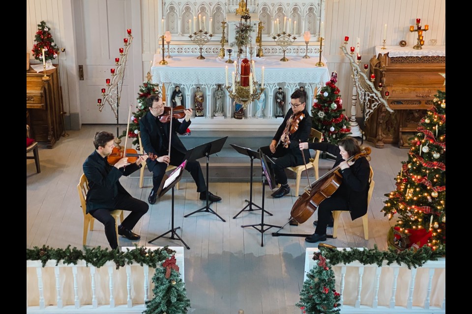 The members of the Edmonton-based VIF String Quartet performing at the festive Christmas at the Mission concert, which took place on Sunday, Dec. 3 at the 100-year-old Lac La Biche Mission church. Photo by Christelle Shepherd.